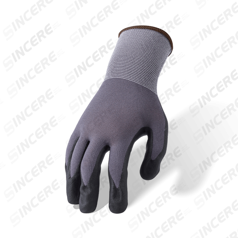 Guantes de spandex de nailon calibre 15 con palma de microespuma de nitrilo negro y empuñadura de puntos de nitrilo irregular gris